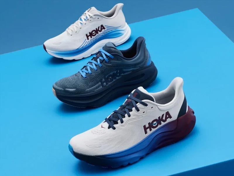Three HOKA shoes on a white background