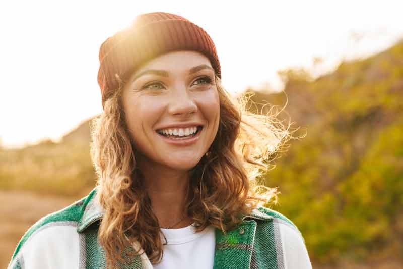 Smiling woman in a stocking cap