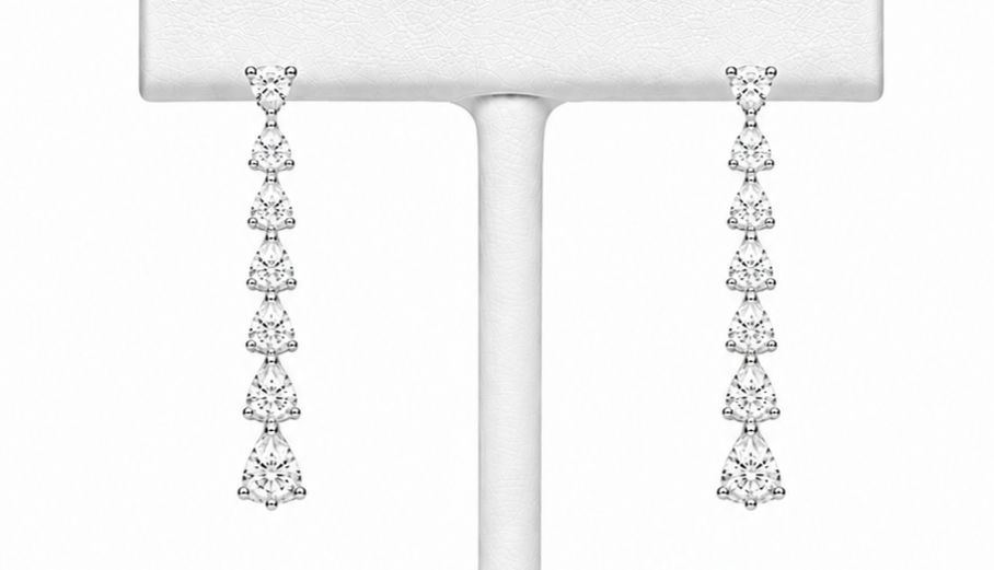 14kt white gold 3-prong martini 2.00cttw 7 round diamonds graduated earrings. Each earring contains 7 diamonds for a total of 14.