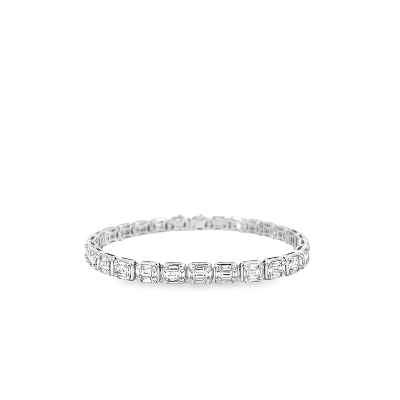 18kt white gold 140 baguette diamond 3.45cttw and 112 round diamond .71cttw fashion bracelet. Total Diamond Weight 4.16 Carats