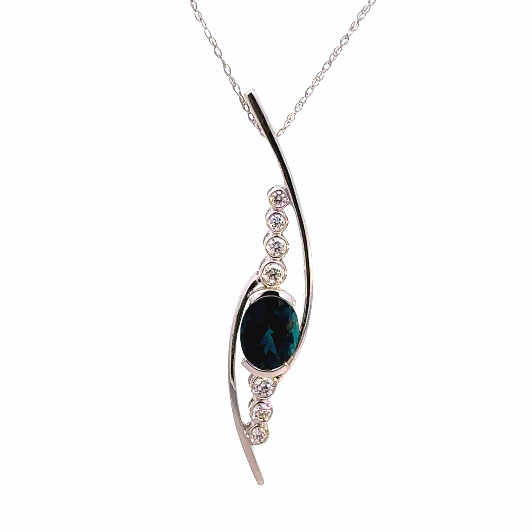 Green Tourmaline Pendant, 14K White Gold with half bezel set Green Tourmaline and eight round diamond accents on a 14K White Gold fine display chain. 