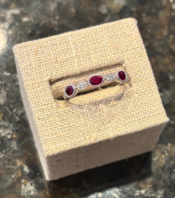 Stunning Oval Ruby& Natural Diamond Milgrain Bezel Band in 14-Karat White Gold, 3R=.56CT, 8D=.05CT. Size 6.5