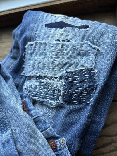 visible mending on jeans
