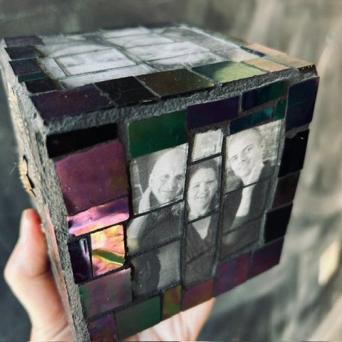 cube with mosaics and photos