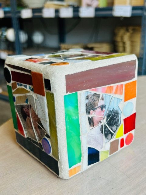 Colorful version of photo mosaic on a cube