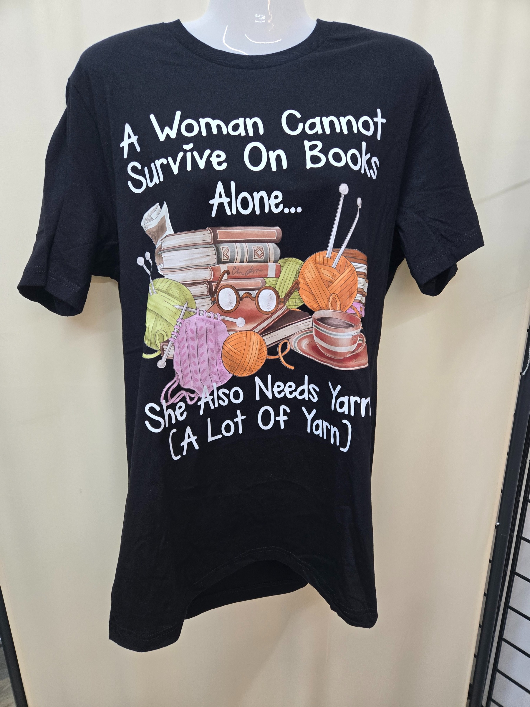 Novelty T-Shirt A Woman Cannot Survive On Books Alone...She Also Needs Yarn (A Lot Of Yarn)