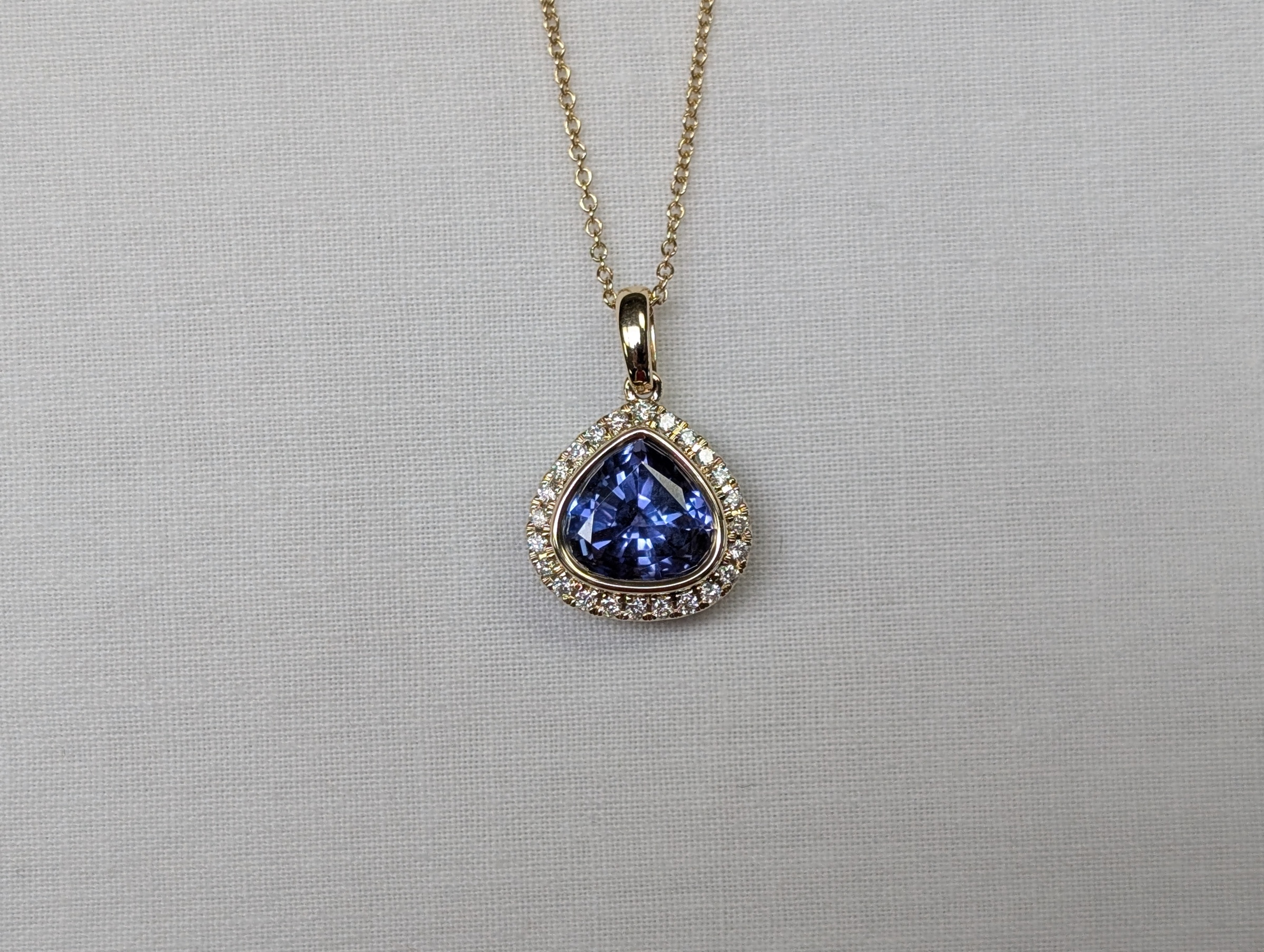 14kt WG Trillion 2.42ct Tanzanite and 24=.17cttw GHSI diamond halo pendant with 18 Chain 25-4-4972 FPOETF