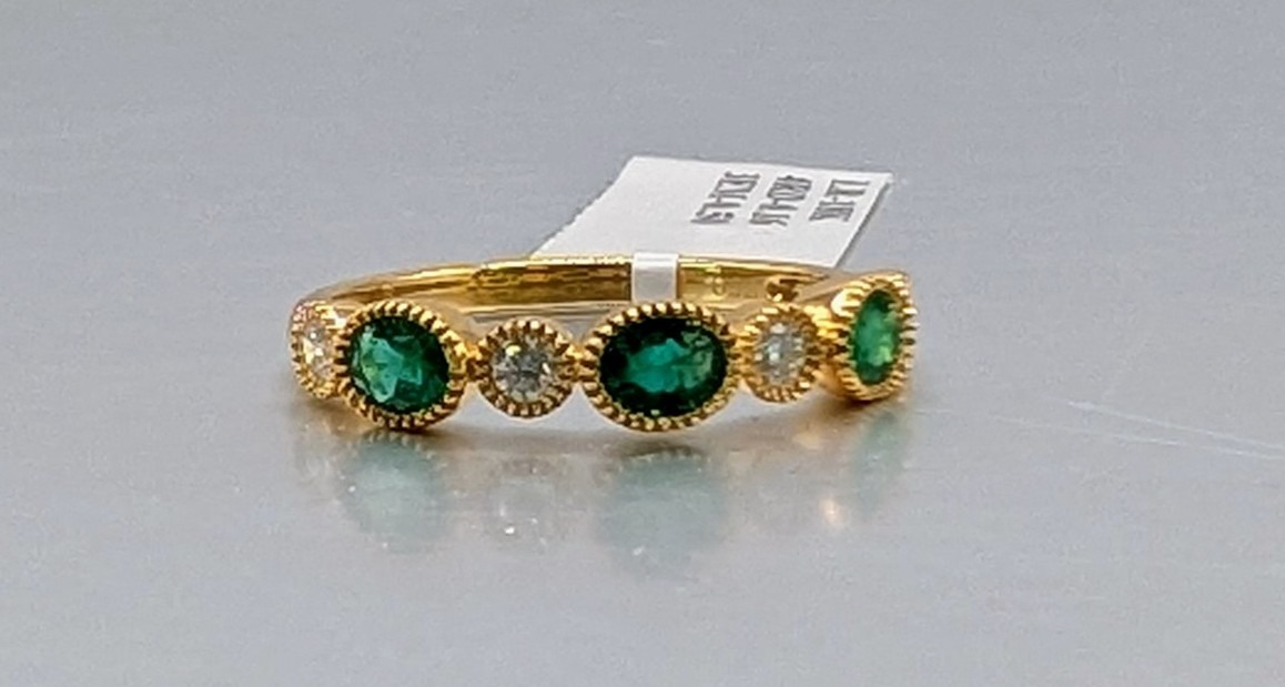 18k Yellow gold emerald and diamond ring, size 6.5, .16(dia) .50 (EM)