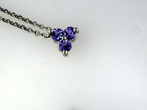 0.25cttw Round Cut Tanzanite Pendant Prong Set in 14K White Gold on an 18 Chain
