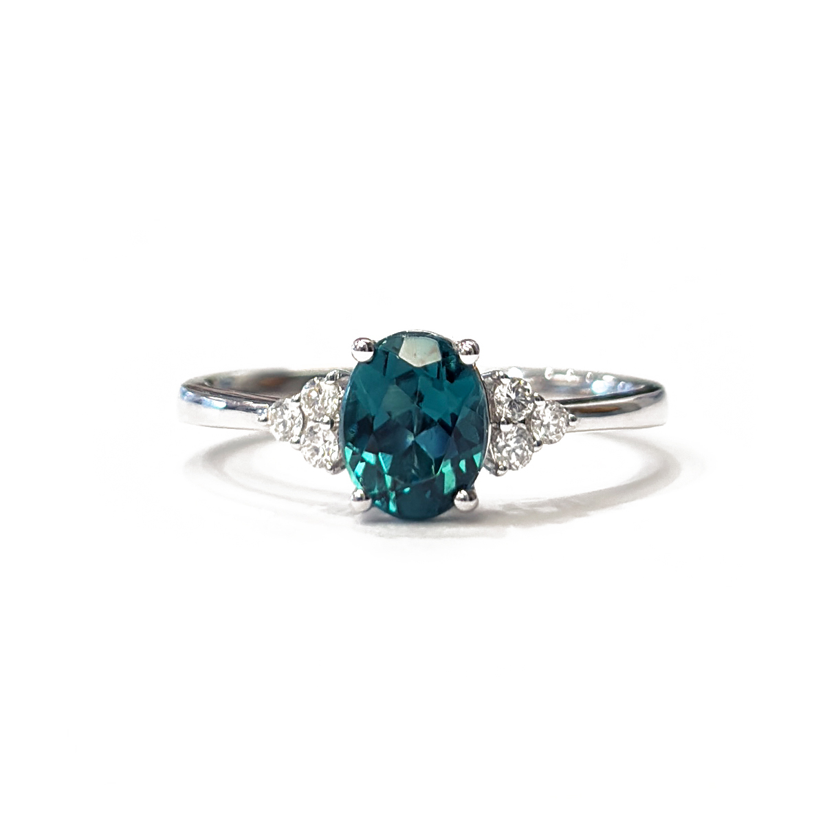 0.57ct Oval Cut Indicolite Tourmaline Three Dories Ring with 0.13cttw Diamond Accents Prong Set in 18K White Gold