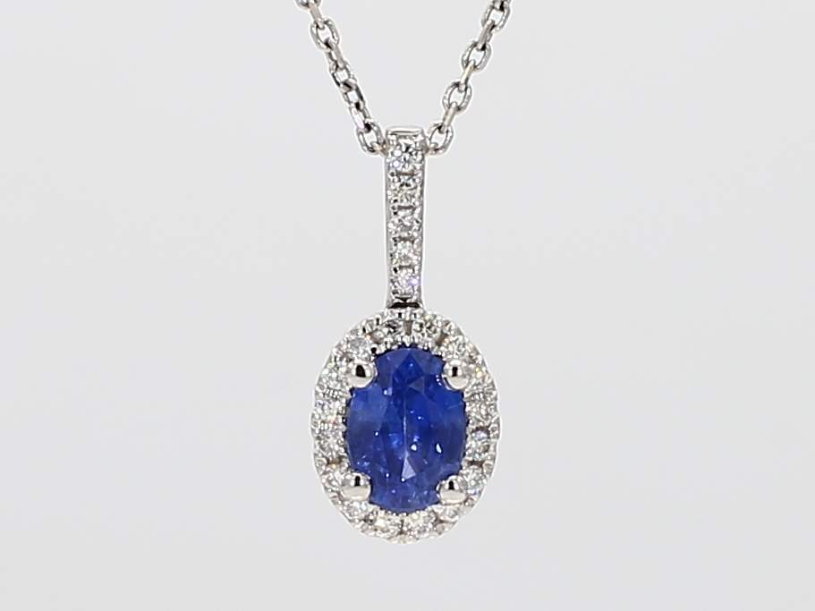 0.75ct Oval Cut Sapphire Pendant with a 0.14cttw Diamond Halo Prong Set in 14K White Gold on an 18 Box Chain