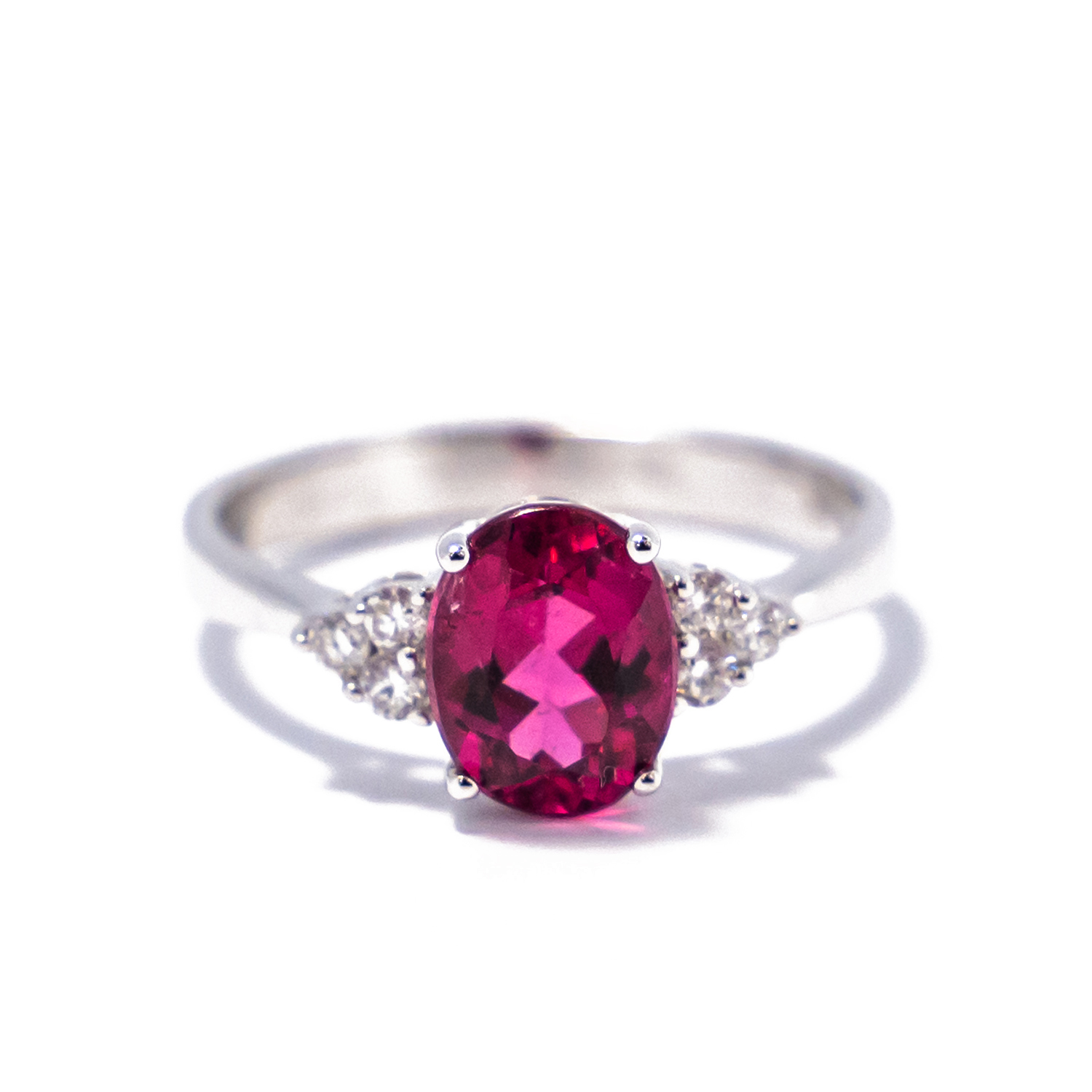 1.60ct oval pink tourmaline set with .13cttw of round diamonds in 18k white gold ring