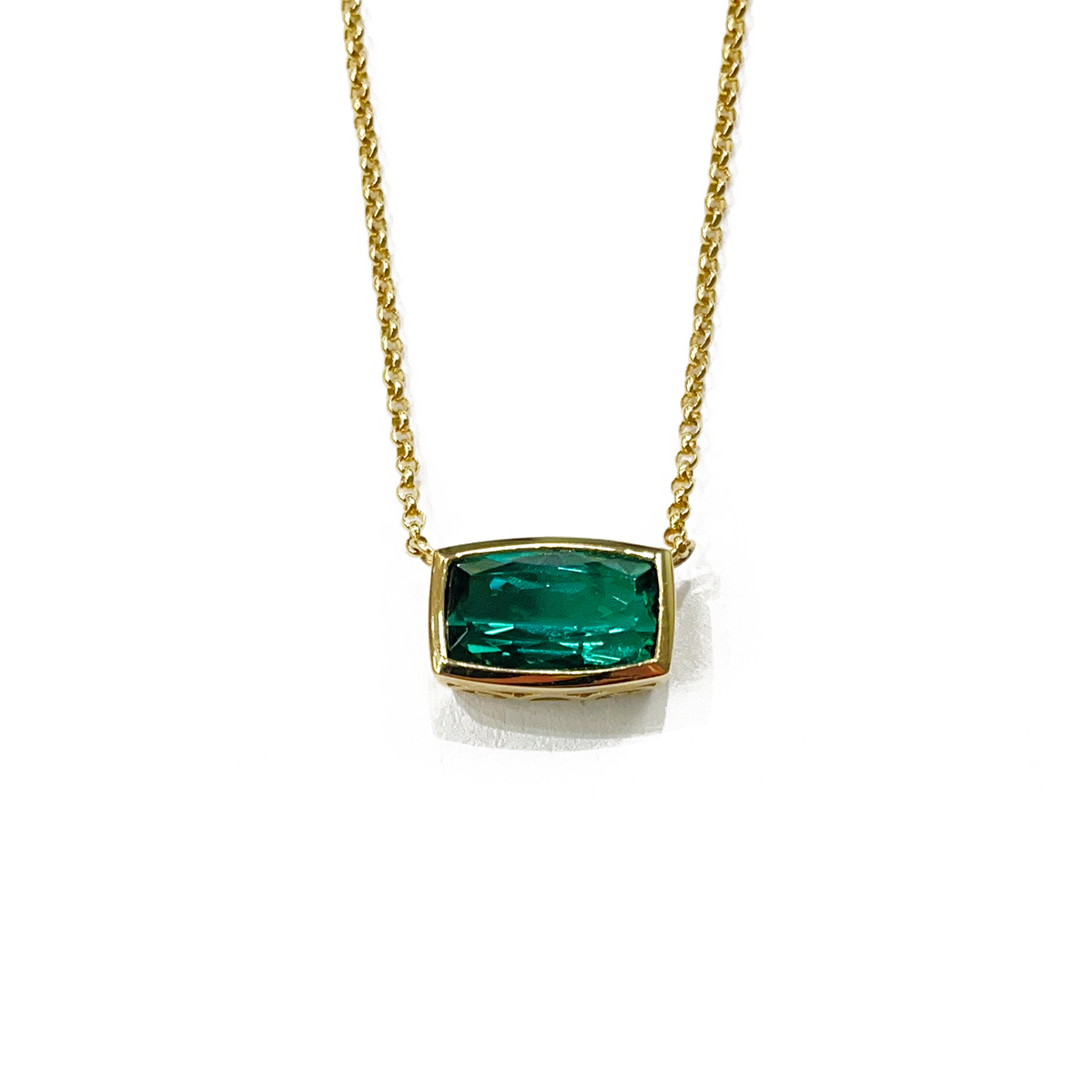 1.79ct cushion cut blue green tourmaline bezel set in 18k yellow gold pendant set east west 18 adjustable 18k gold chain