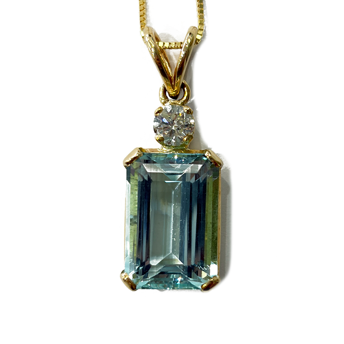 9.50ct Emerald Cut Aquamarine Pendant with a 0.47ct Diamond Accent Prong Set in 14K Yellow Gold on an 18 Chain
