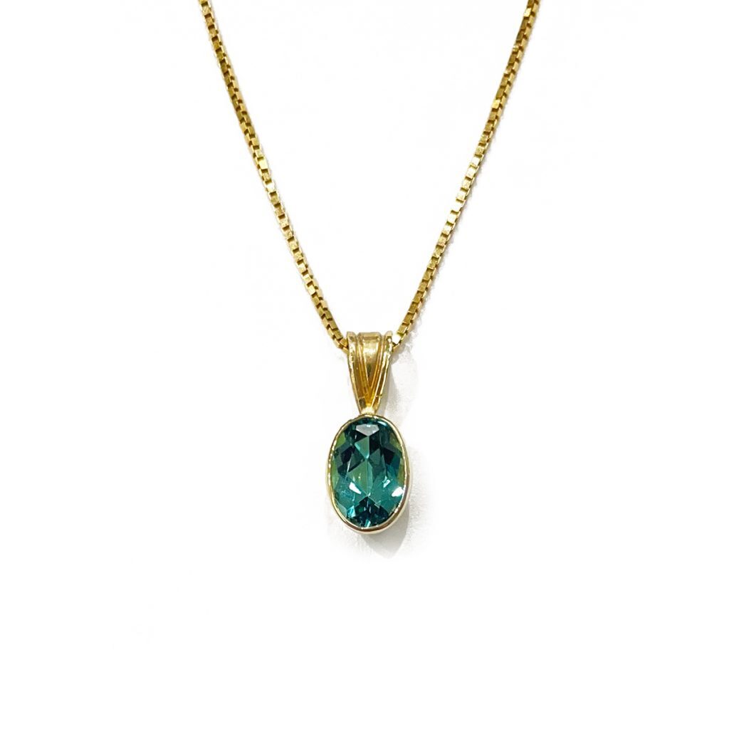 .88ct oval blue tourmaline bezel set in 14k yellow gold pendant 14k yellow gold 18 box chain