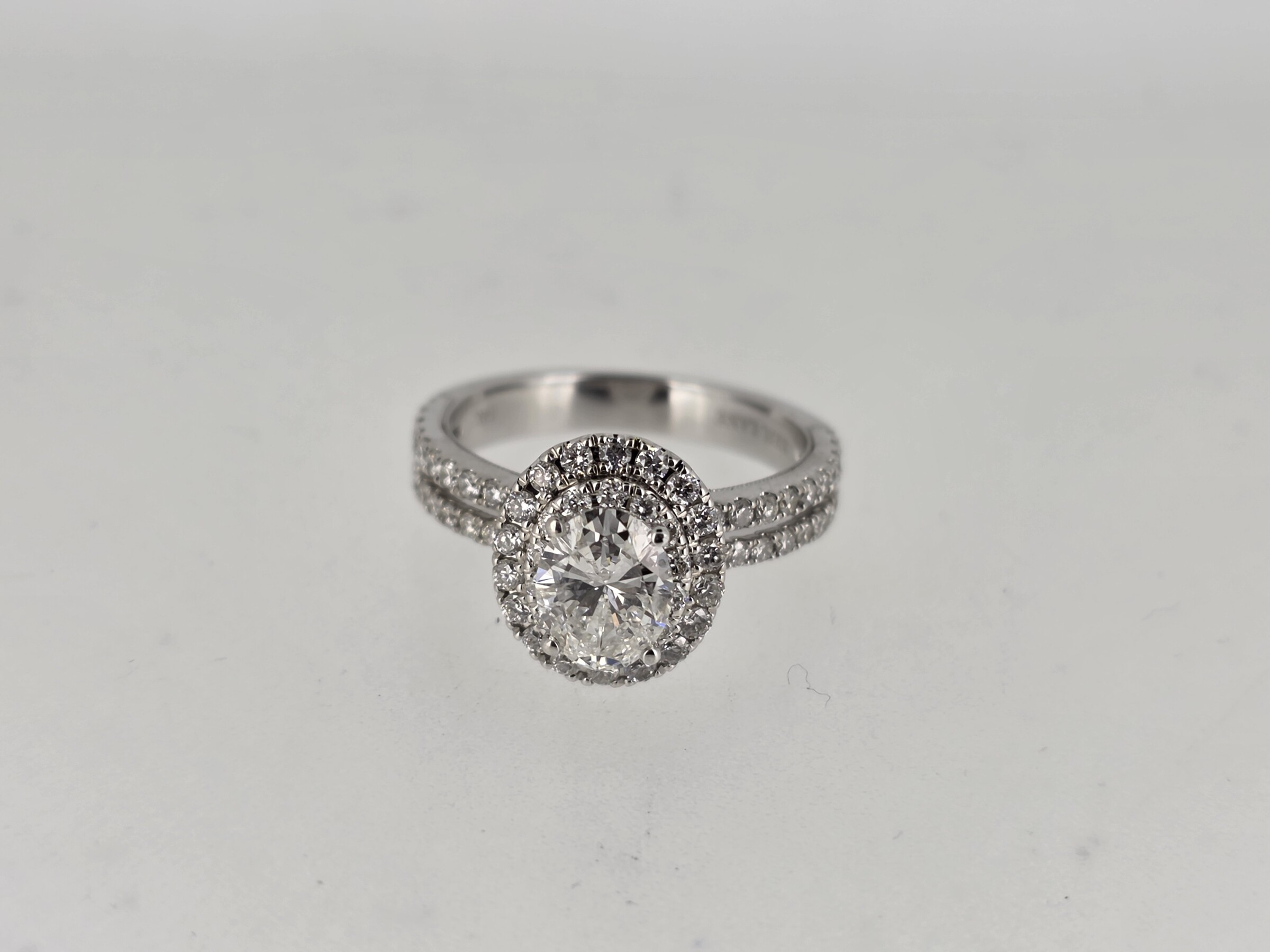 1.00 Ct Oval Diamond Set into Neil Lane Engagement Ring with Double Halo and Double Band with Eighty Eight (88) Round brilliant Cut Diamond with a total weight of approx. .75 Cts