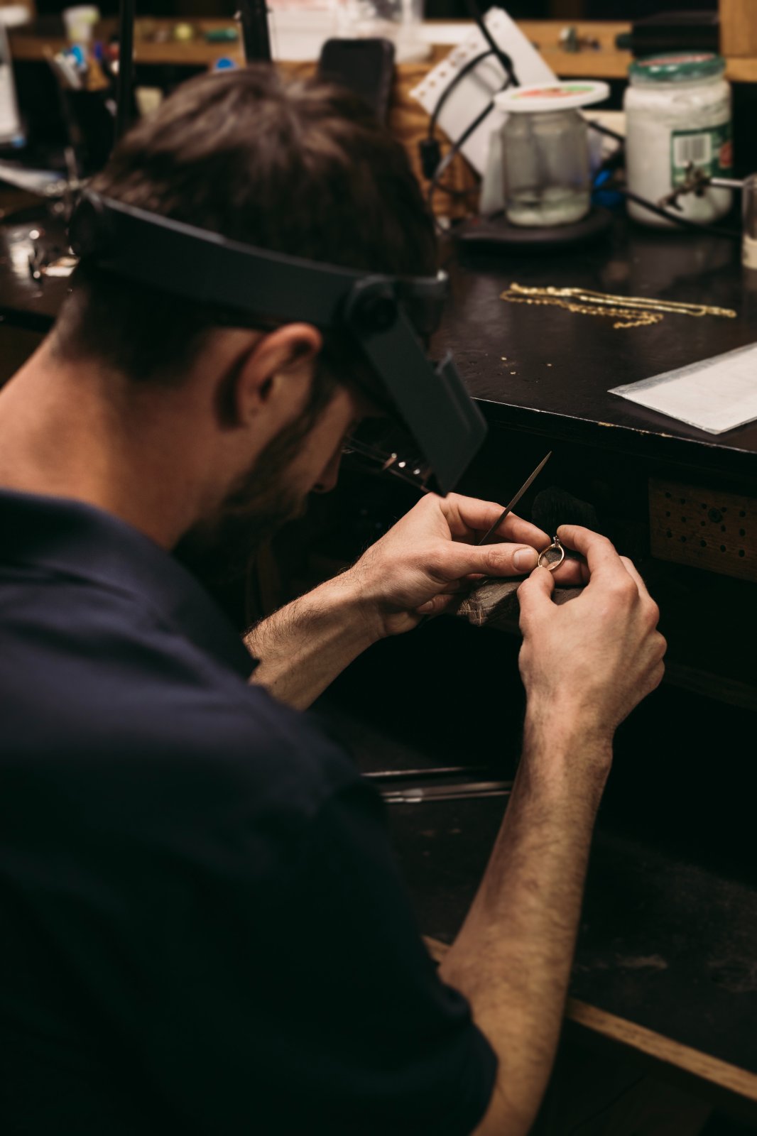 Bench jeweler performing jewelry restoration work at Reagan Steele Jewelers