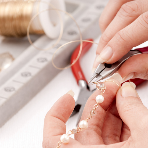 Permanent jewelry styling with meaningful charm and chain details