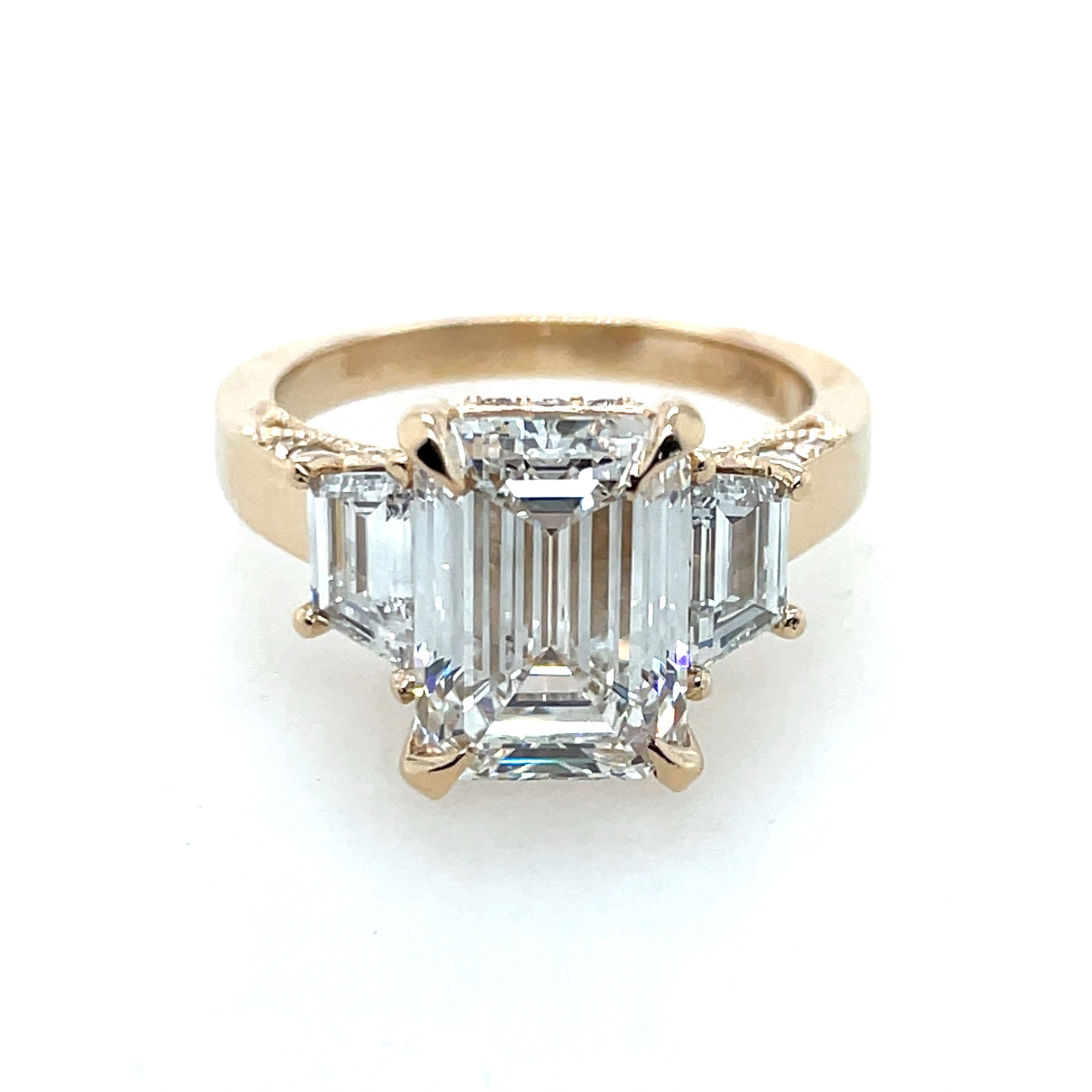 Lab Grown Diamond Three Stone Engagement Ring with 4.09ct Emerald Cut Center and 1.02ct TW Trapezoids