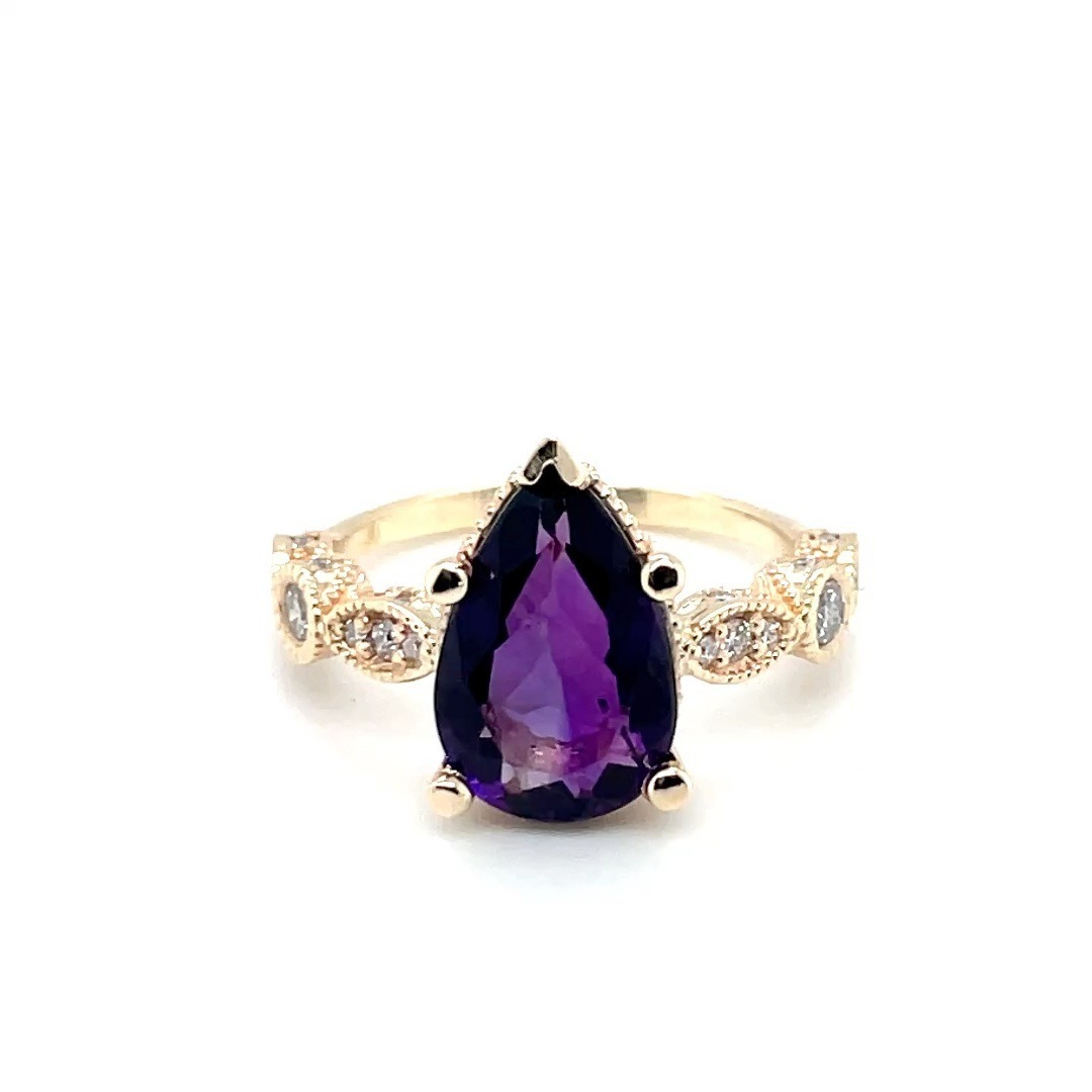 Pear Shape Amethyst Fashion Ring set in 14k Yellow Gold with .16ct total weight Diamonds SI1/G