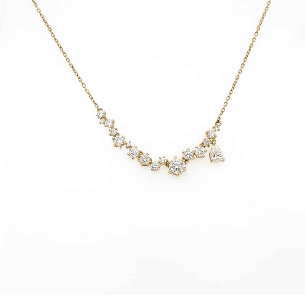 14k Yellow Gold Custom Designed Ladies Necklace With Sixteen Round Brilliant Diamonds Totaling  1.14ct Of F Color, VS1 & 0.26ct Pear Shape Diamond Of F Color, VS1 Clarity; DJ17YDN140
