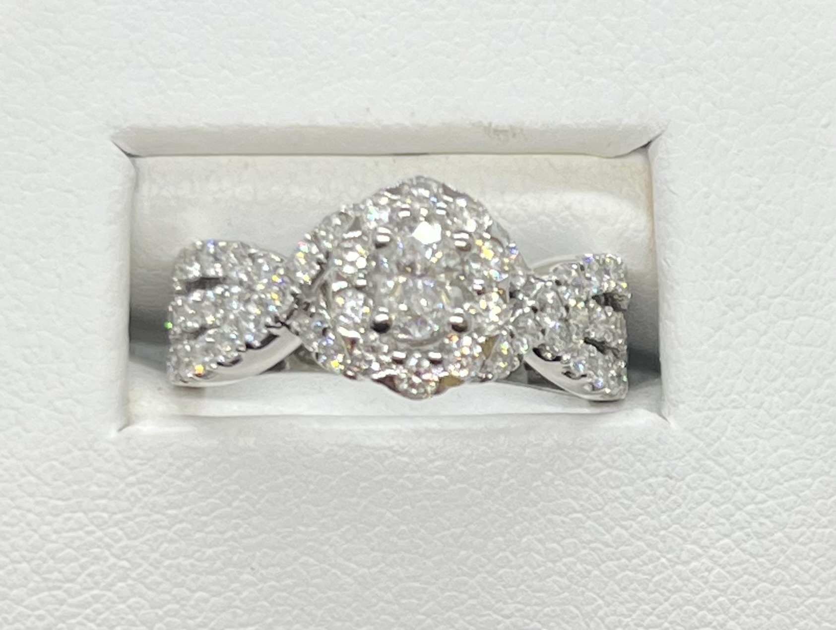 1.42ctw Diamond Ring (.29ct Oval Centre & 1.13ctw surrounding diamonds) Criss cross design with 3 side rows 14K White gold