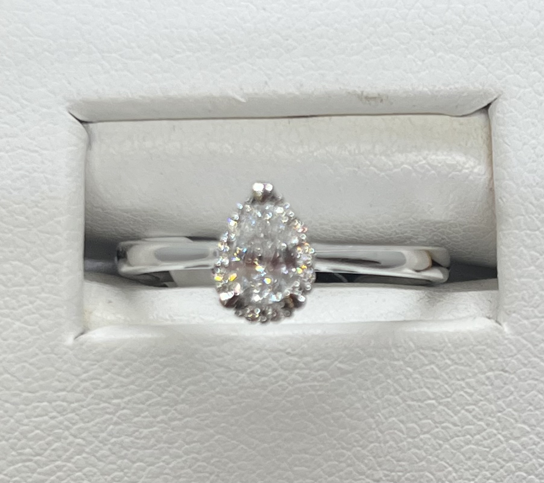 Pear shaped diamond Halo ring with rounds, (Pear .30ctw rnds .05ctw) 14K White gold