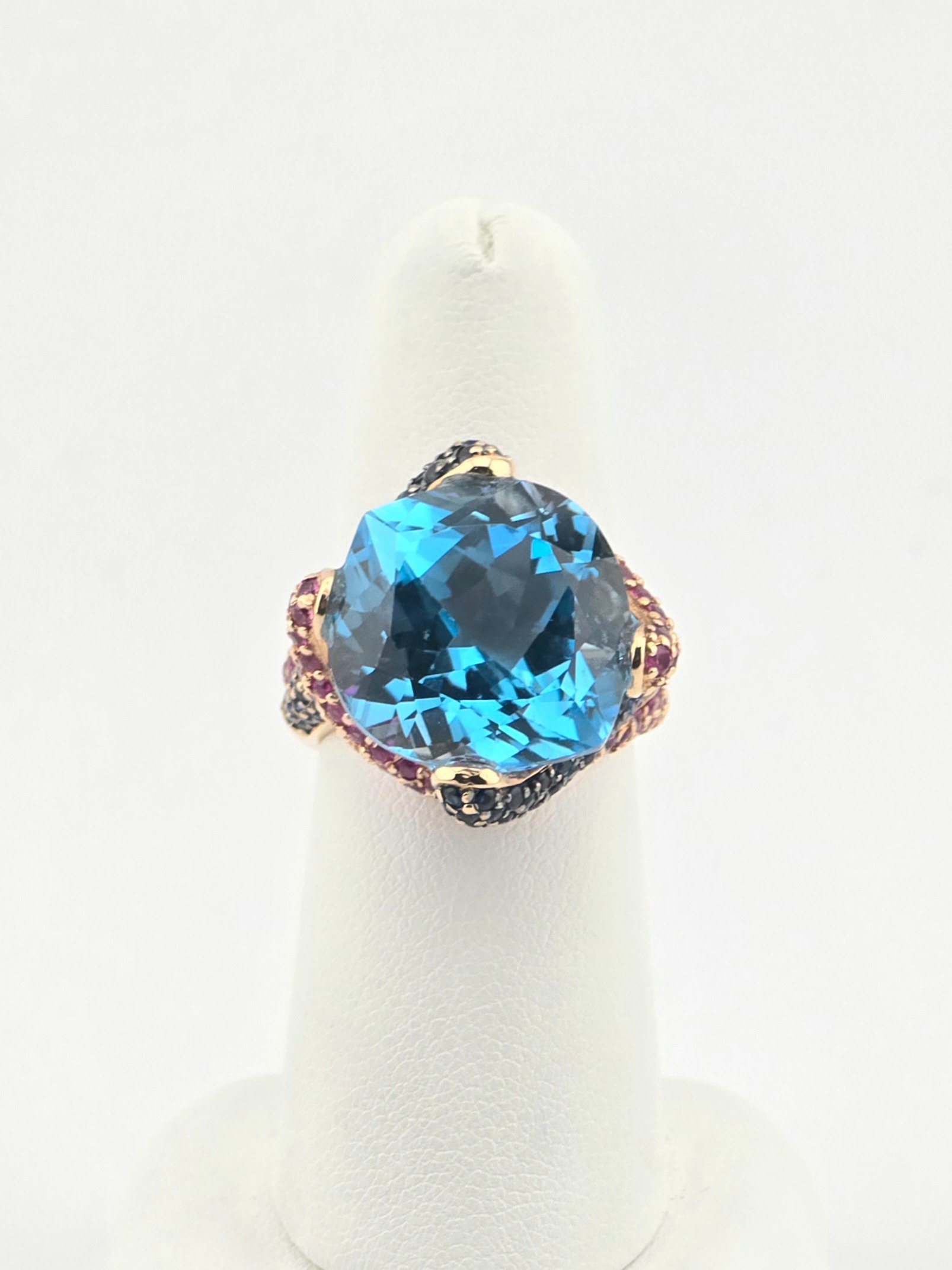 14KR FANCY BLUE TOPAZ ~18CT SAPPHIRE ~1.5CTW RUBY ~0.75CTW SIZE 7