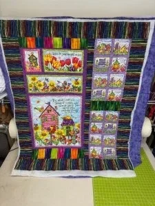 quilt with houses and florals