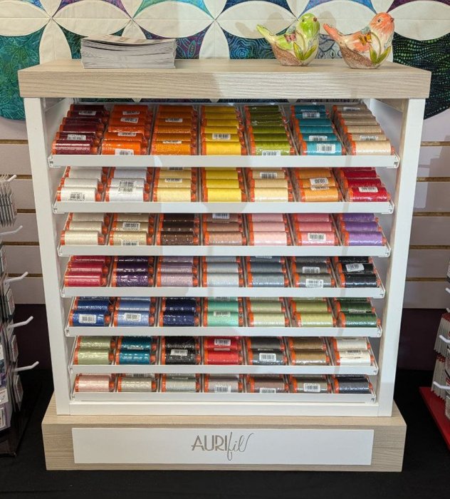 The Qulters Garden Shop Aurifil display, with 49 colors.
