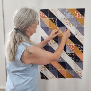 Master Your Stripology Rulers Use a Design wall to find the perfect placement of triangle-square units