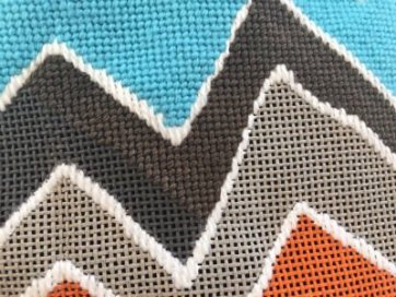 dark needlepoint canvas with dark threads