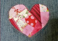 reverse applique of a scrappy quilted heart