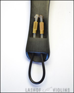 A close up of the underside of a violin tailpiece. The tailgut has two brass nuts attached to it and the plastic of the tailgut has been melted and ballooned to prevent the nuts from slipping off if they ever fail.