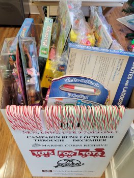 Toys in our overflowing toy box, awaiting to be picked up by Toys for Tots
